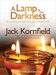 Book cover for "A Lamp in the Darkness" by Jack Kornfield