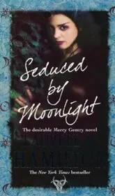 Book cover for "Seduced by Moonlight" by Laurell K. Hamilton